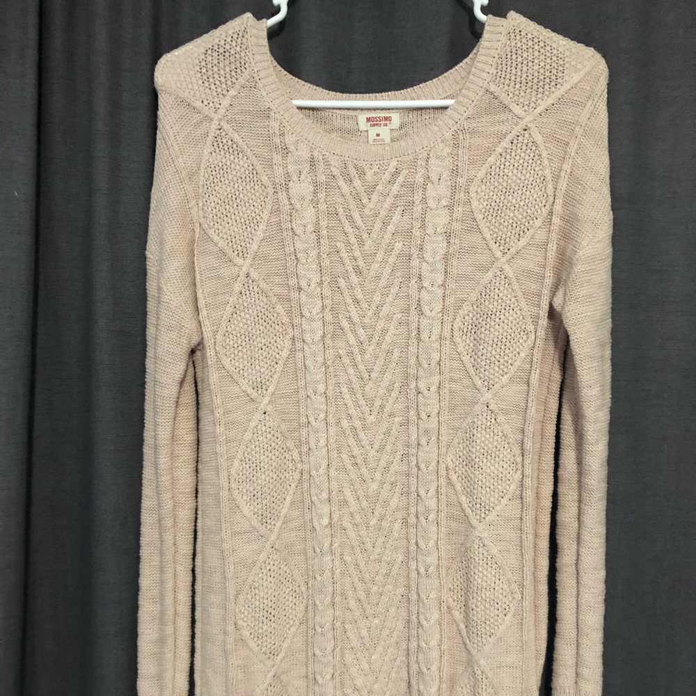 A light pink patterned sweater